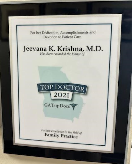 A framed certificate awarded to Jeevana K. Krishna, M.D., recognizing her as a 2021 GA Top Doctor for excellence in family practice.