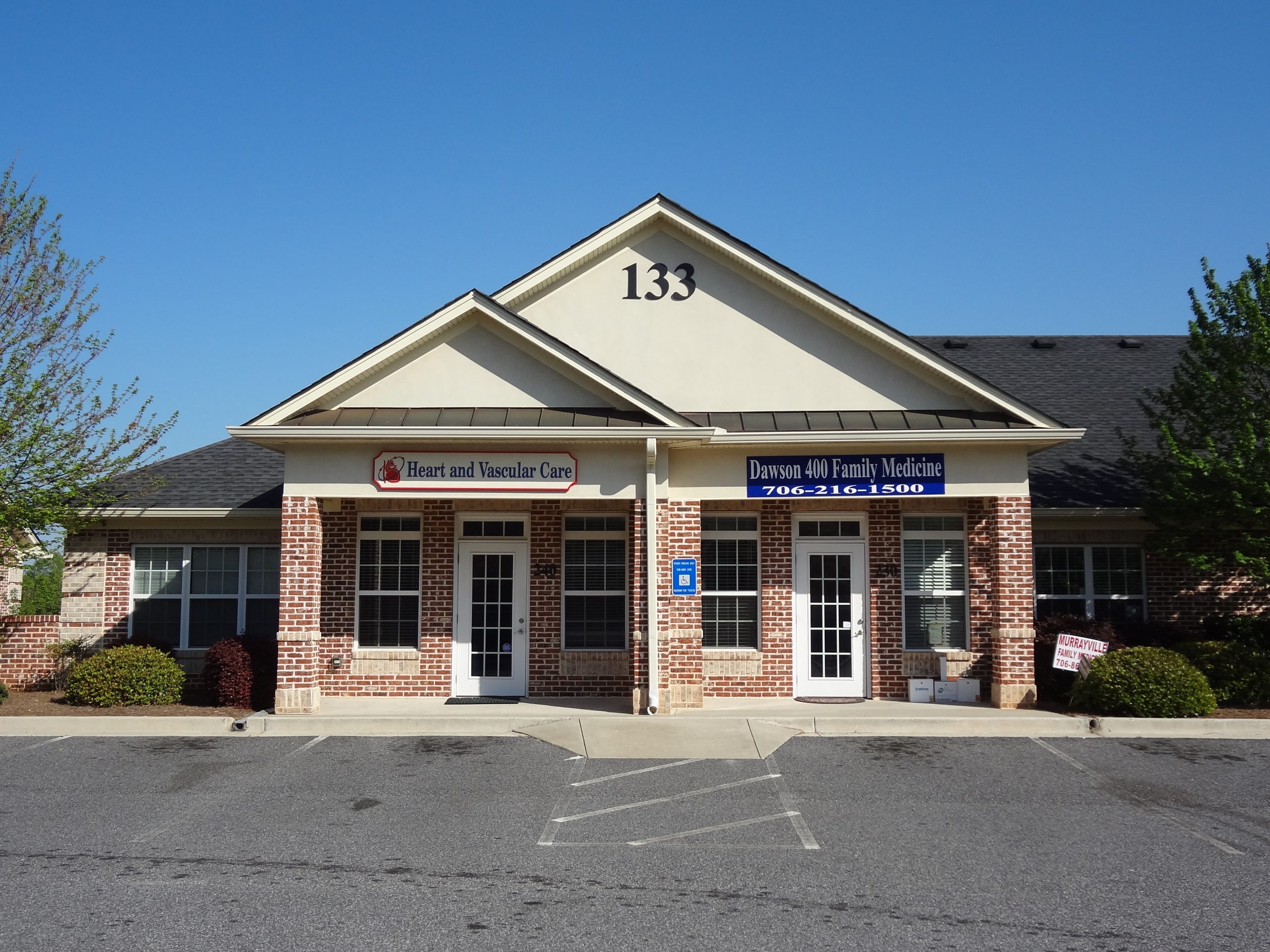 A brick medical office building with two entrances labeled 